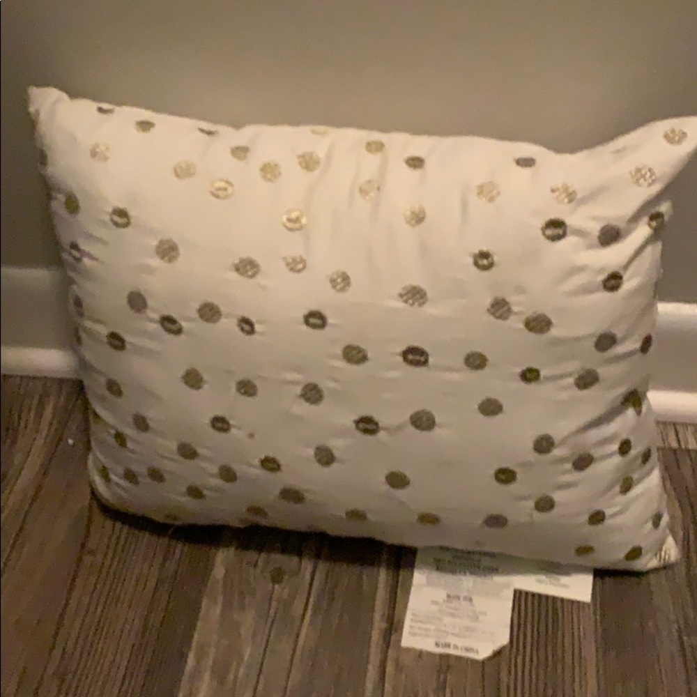 Gold and white throw pillow